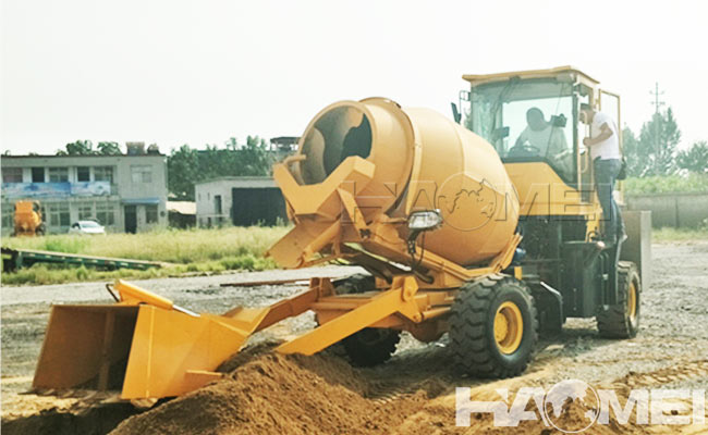 Self feeding concrete mixer
